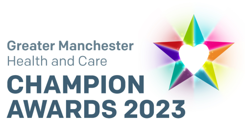 Multi-coloured five-pointed star with a white heart at its centre. Greater Manchester Health and Care Champion Awards 2023.