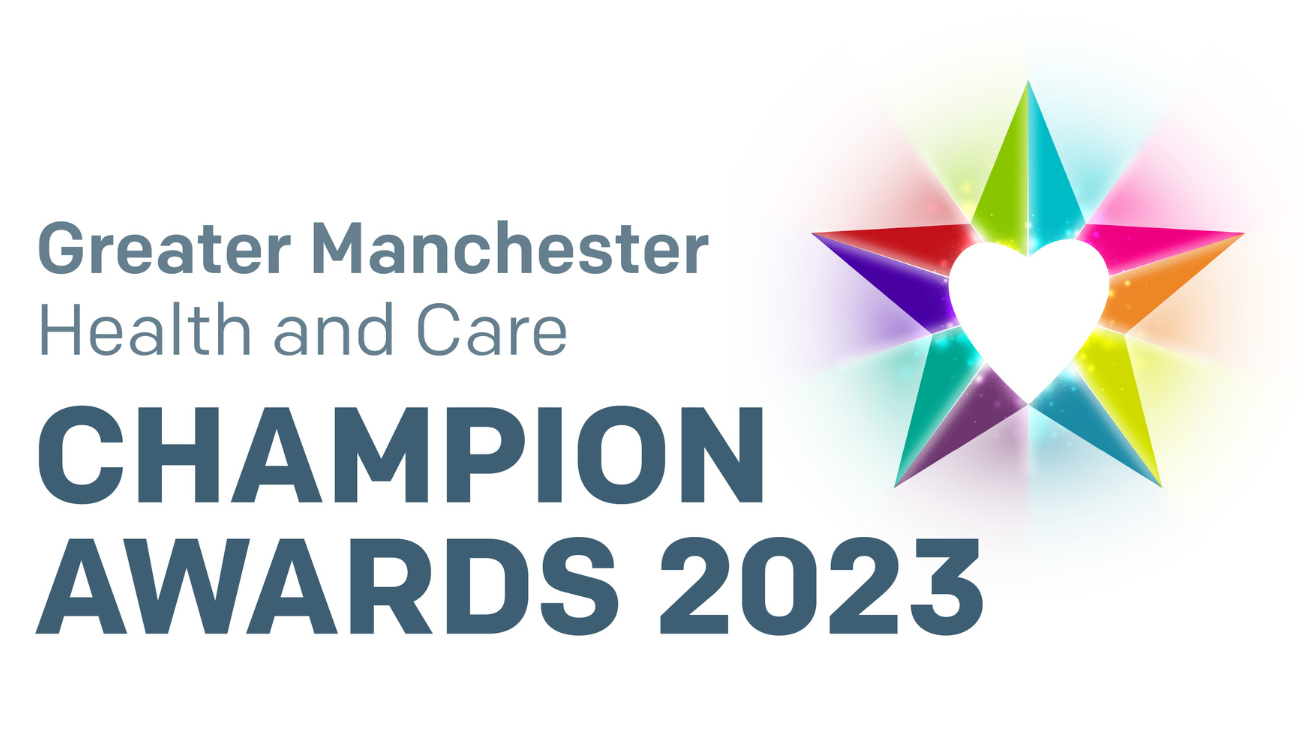 Multi-coloured five-pointed star with a white heart at its centre. Greater Manchester Health and Care Champion Awards 2023.