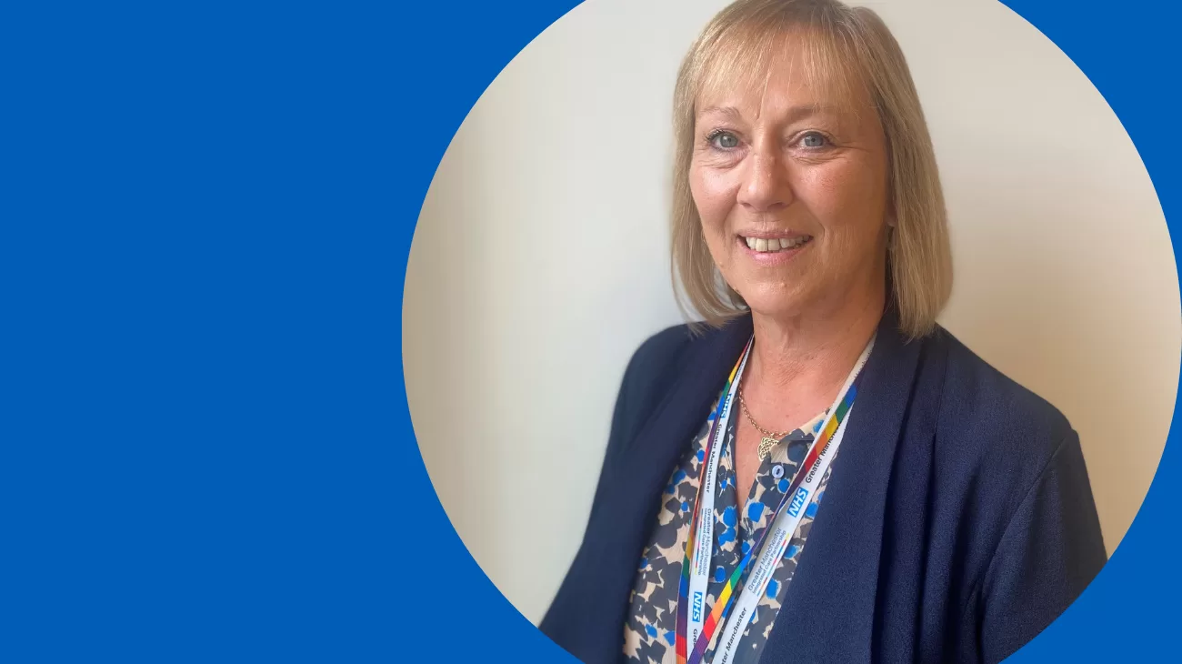 Head and shoulder shot of a smiling Janet Wilkinson, NHS GM chief people officer, looking directly at the camera.