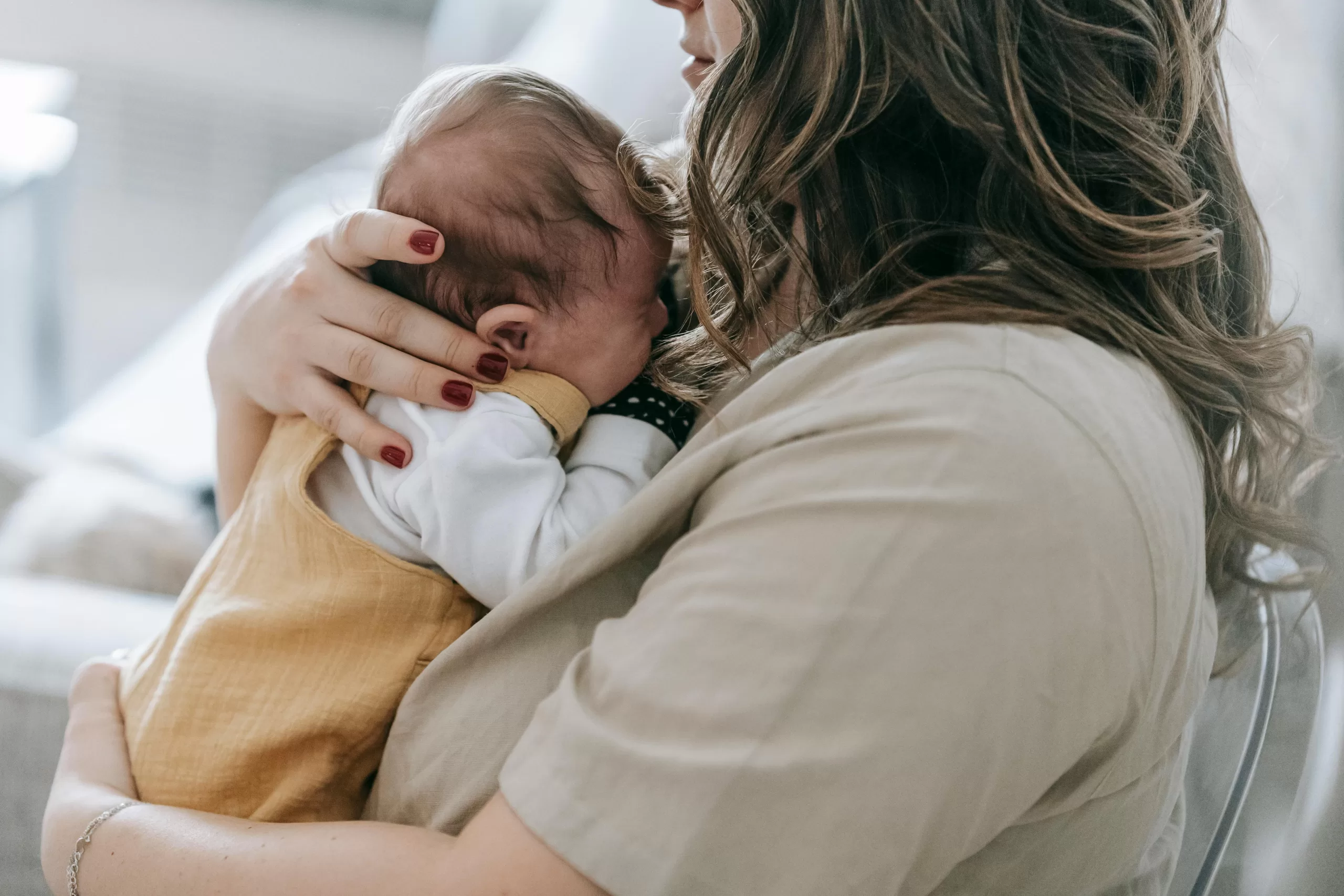 A mum cradling her baby.