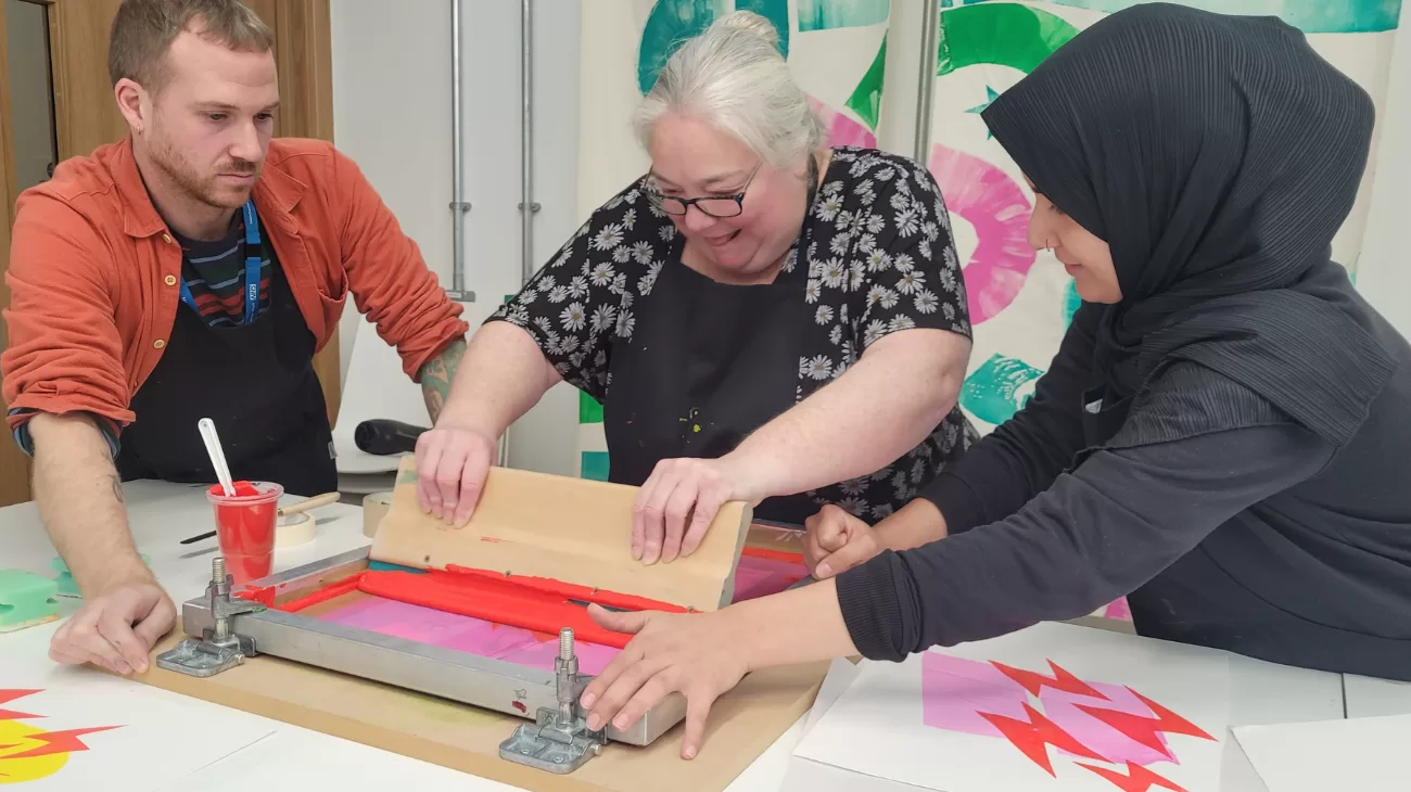 Three people at a creative arts live well event.