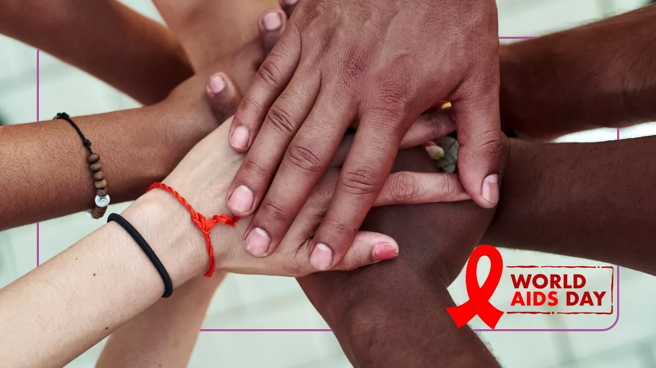 Hands placed on top of each other. Logo World Aids Day