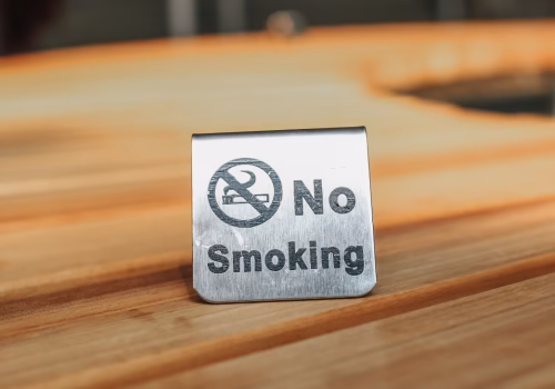 A sign on a table saying "no smoking"