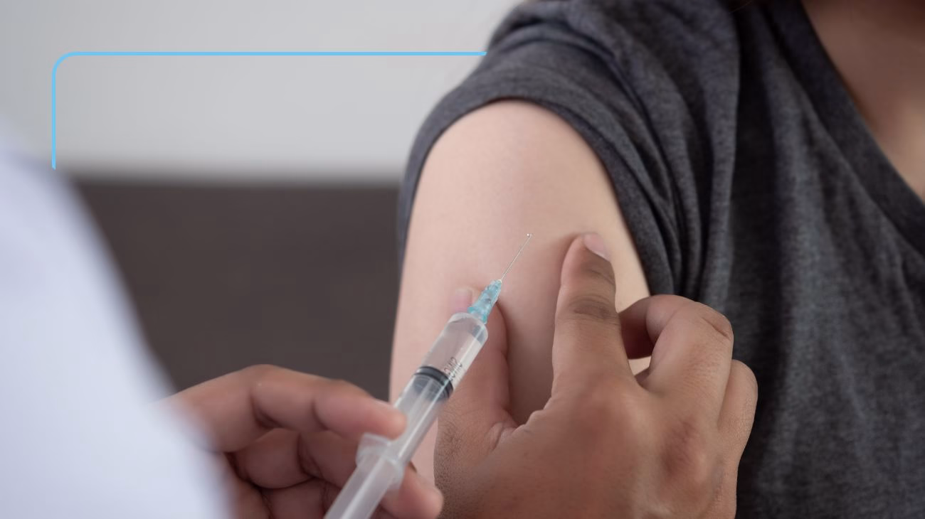 A person having a vaccine.