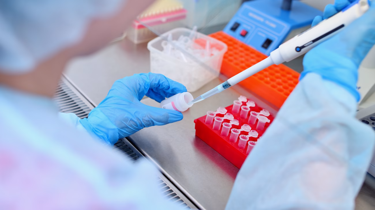 A person in a laboratory carrying out testing
