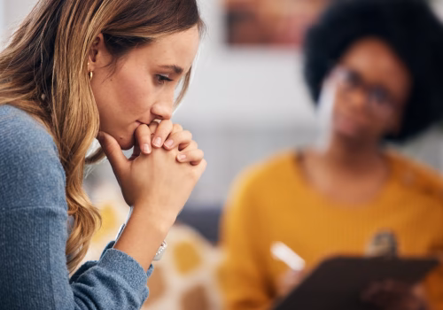 A person talking to a mental health therapist