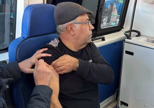 Person having flu jab in an outreach van clinic in Greater Manchester,