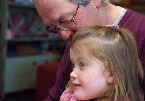 Older people with young grandchild.