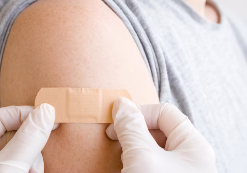 An arm having a plaster applied.