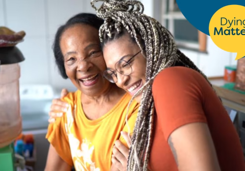 image of two people hugging and smiling