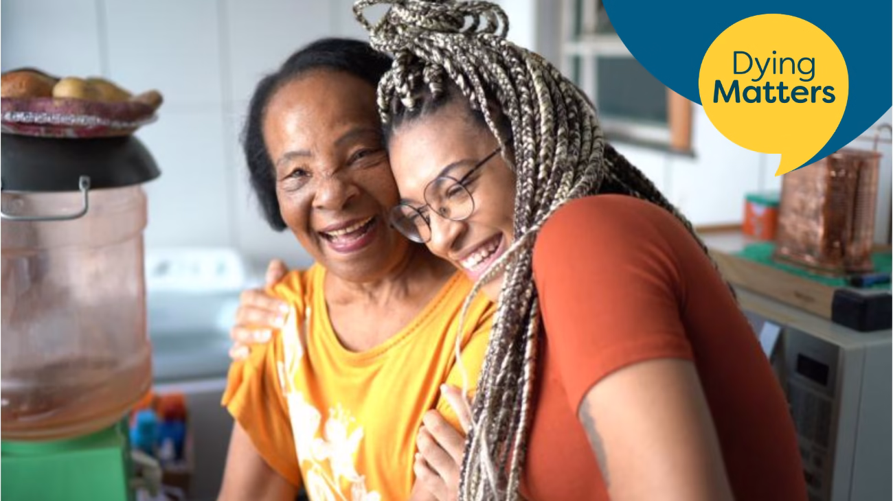 image of two people hugging and smiling