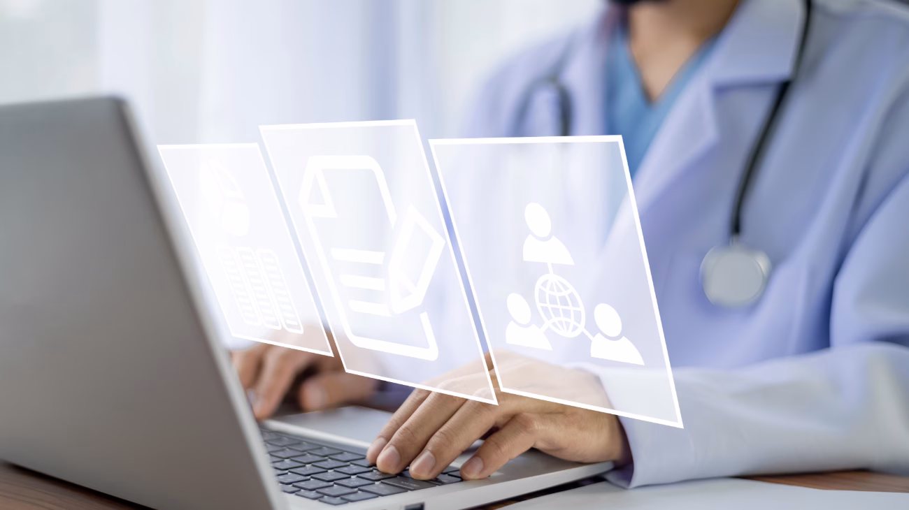 Doctor on computer looking at patient files