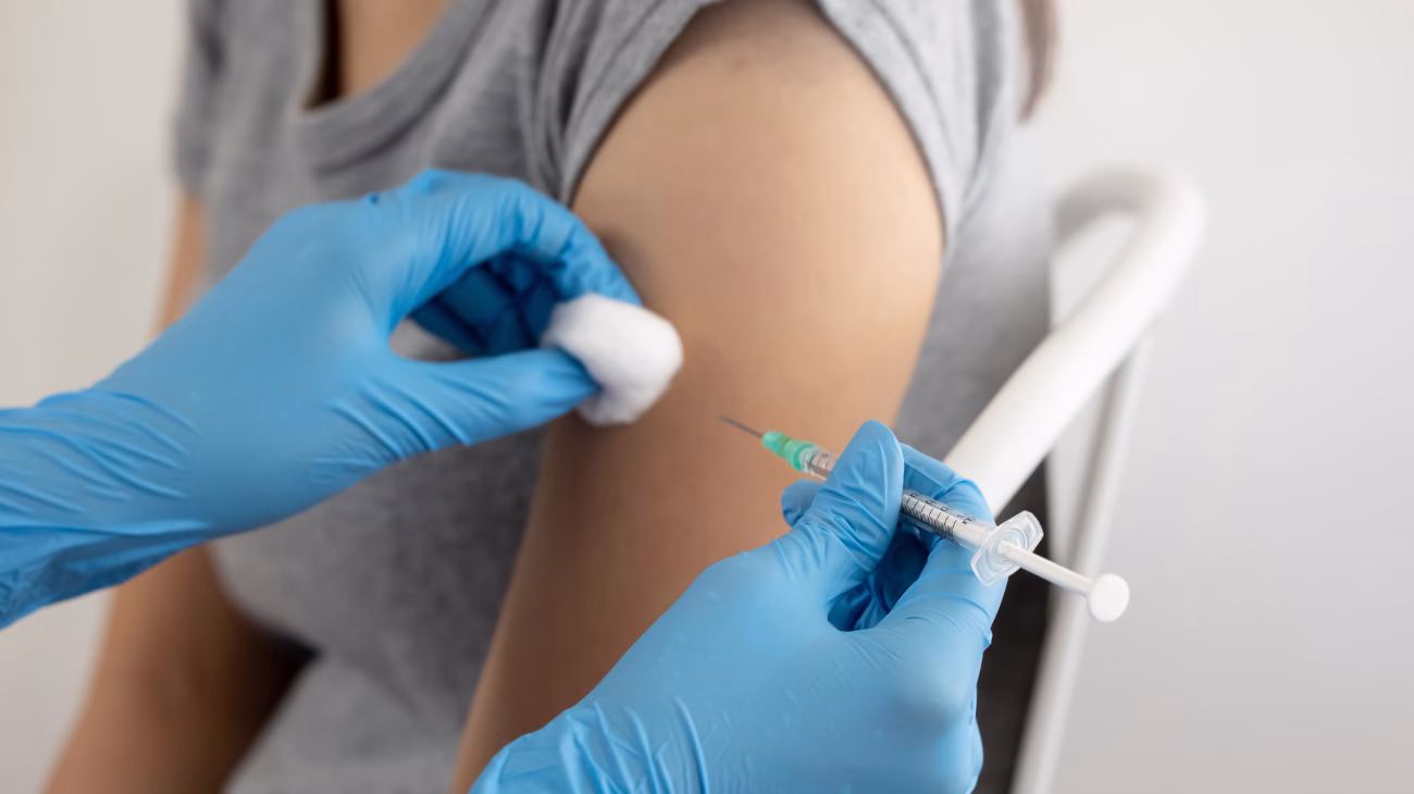 Person receiving a vaccination