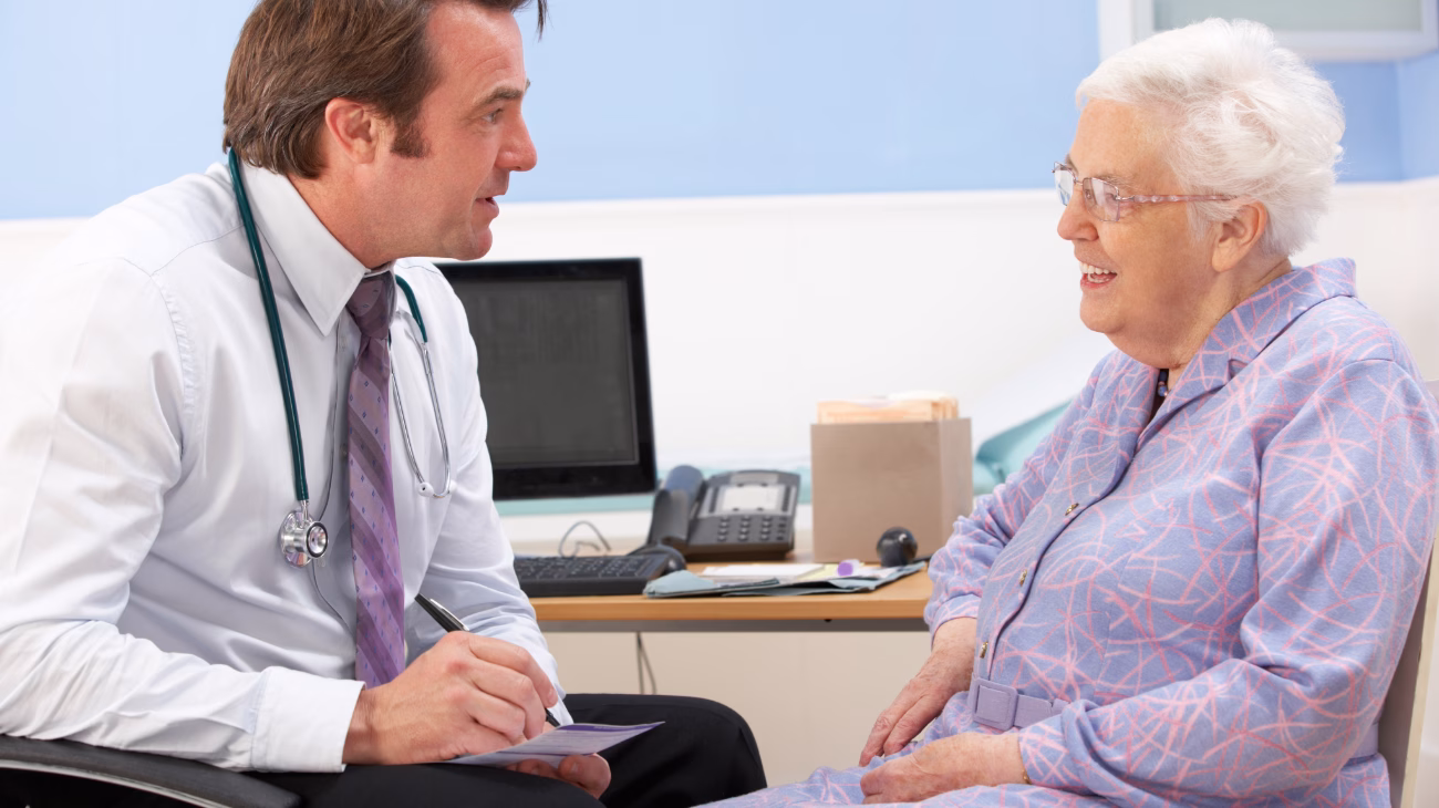 GP talking to an elderly person